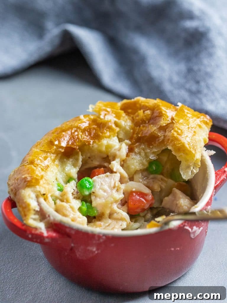Chicken Pot Pie with Flaky Puff Pastry Crust 9 easy chicken pot pie with puff pastry in red ramekin