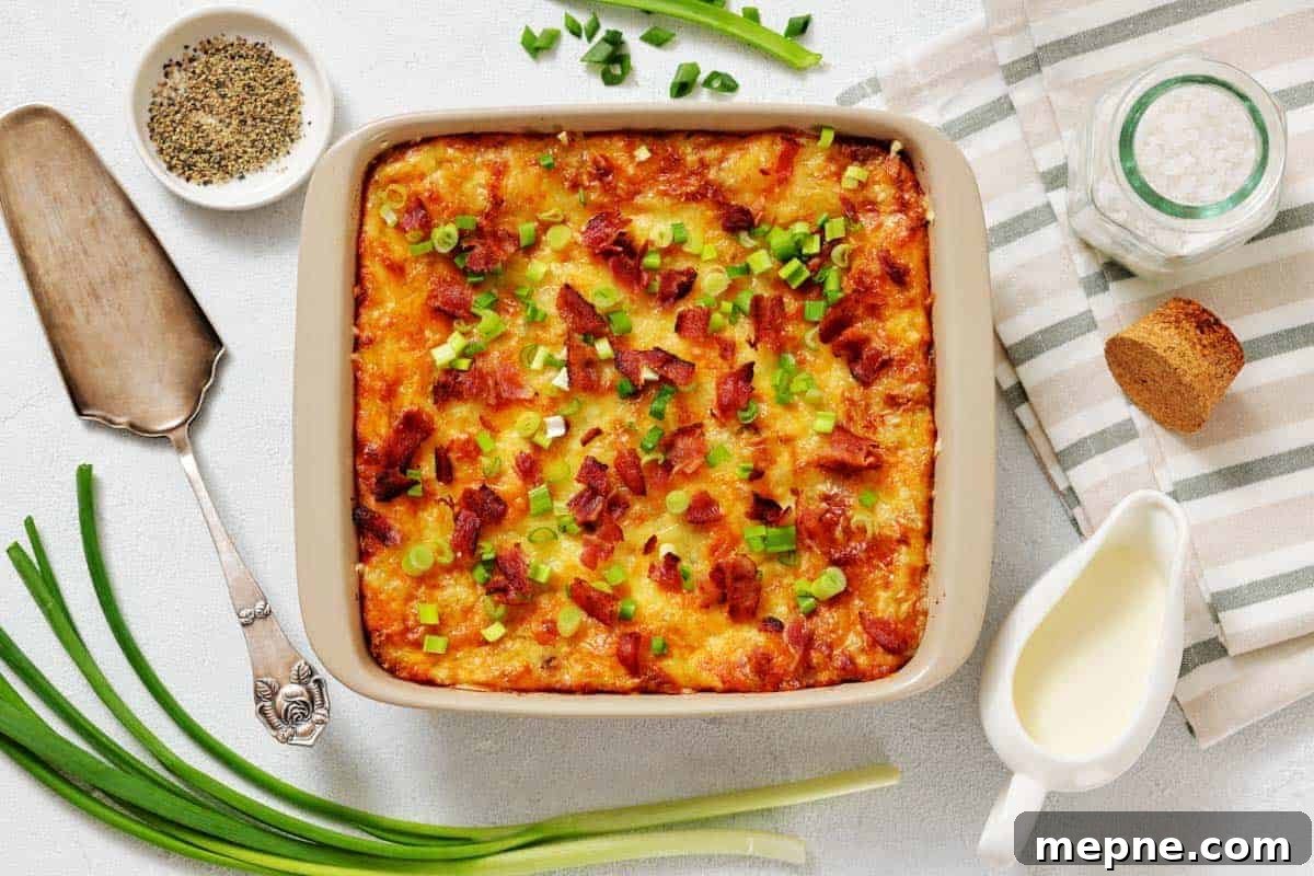 31 Southern Recipes That Belong in Your Dinner Rotation 14 Grandma’s Twice-Baked Potato Casserole topped with chopped green onions and bacon, surrounded by fresh green onions.