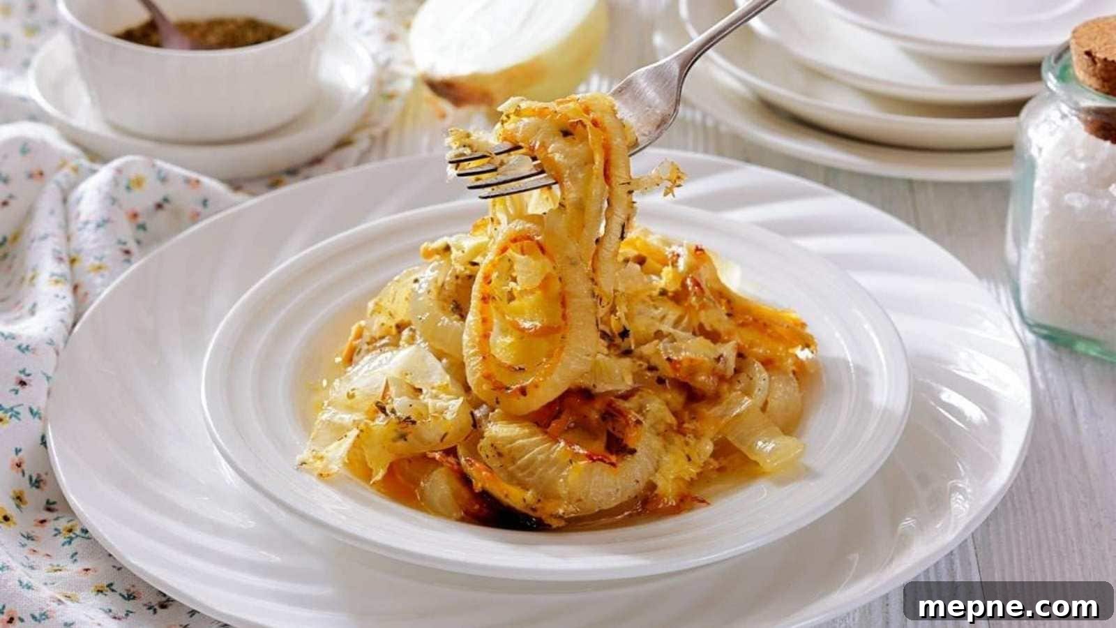 31 Southern Recipes That Belong in Your Dinner Rotation 28 A plate of Tennessee onions garnished with herbs, with a fork lifting a portion. Plates, a jar of salt, and a bowl of seasoning are in the background.