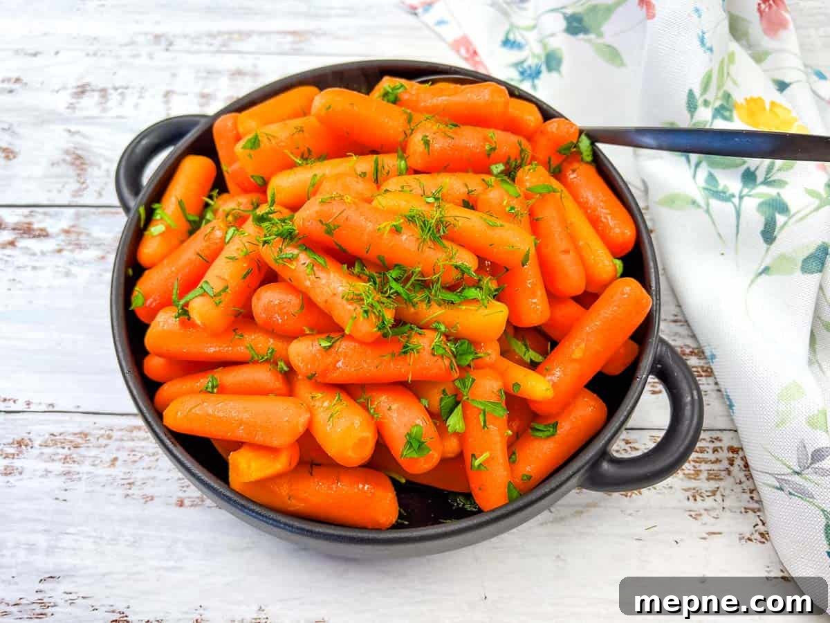 31 Southern Recipes That Belong in Your Dinner Rotation 32 Copycat Cracker Barrel Baby Carrots in a white bowl.