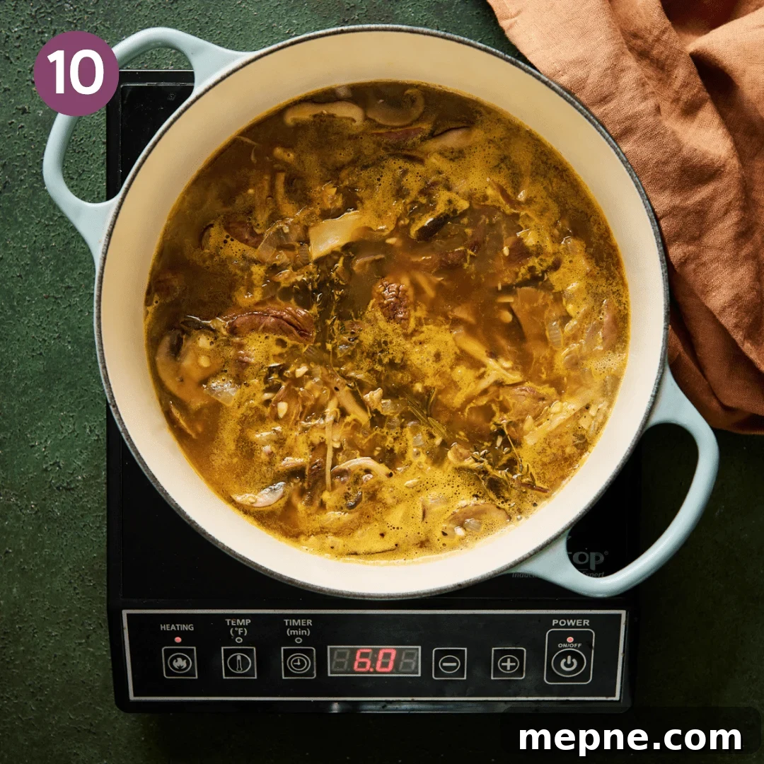 simmered mushroom soup in a light blue dutch oven.