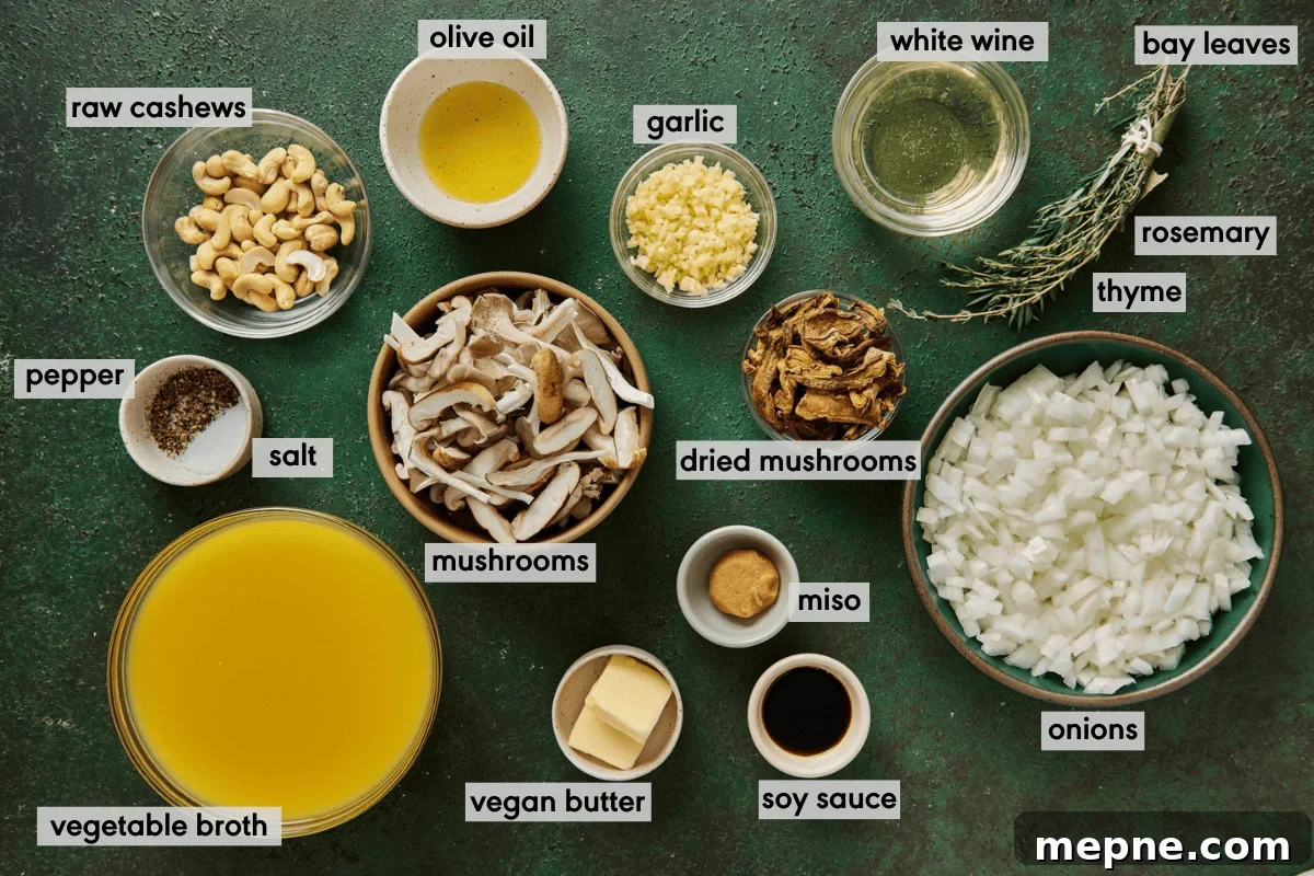 ingredients for vegan mushroom soup in bowls laid out on a green table with ingredients labeled.