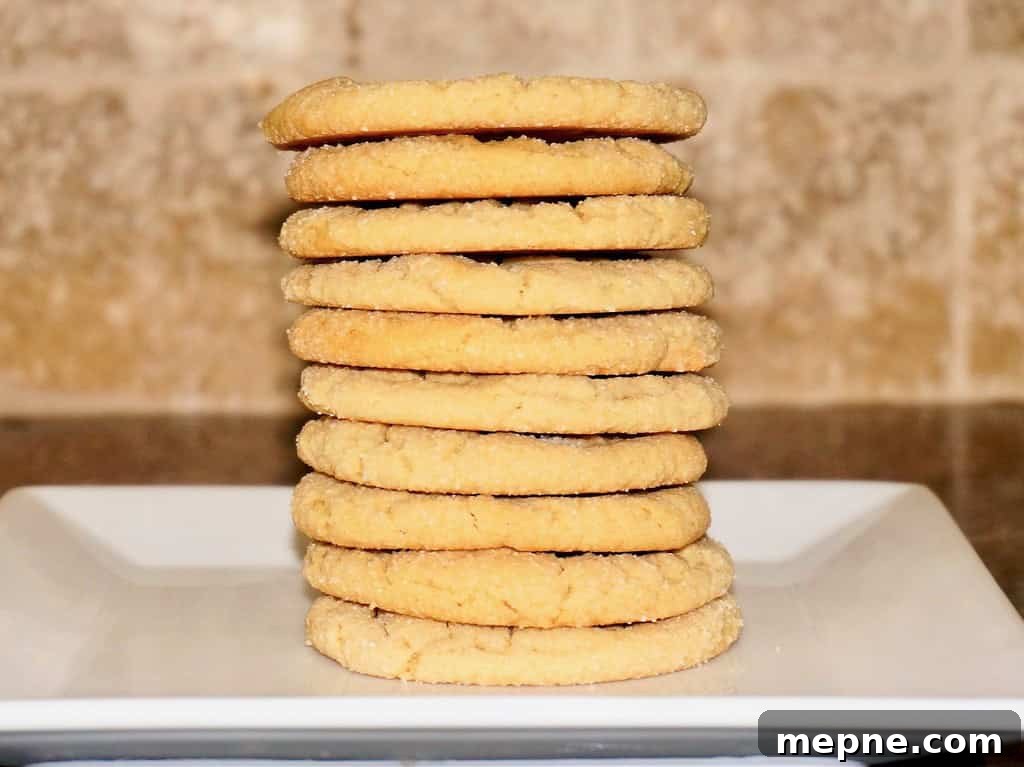 stacked peanut butter cookies showing off their straight sides and even baking