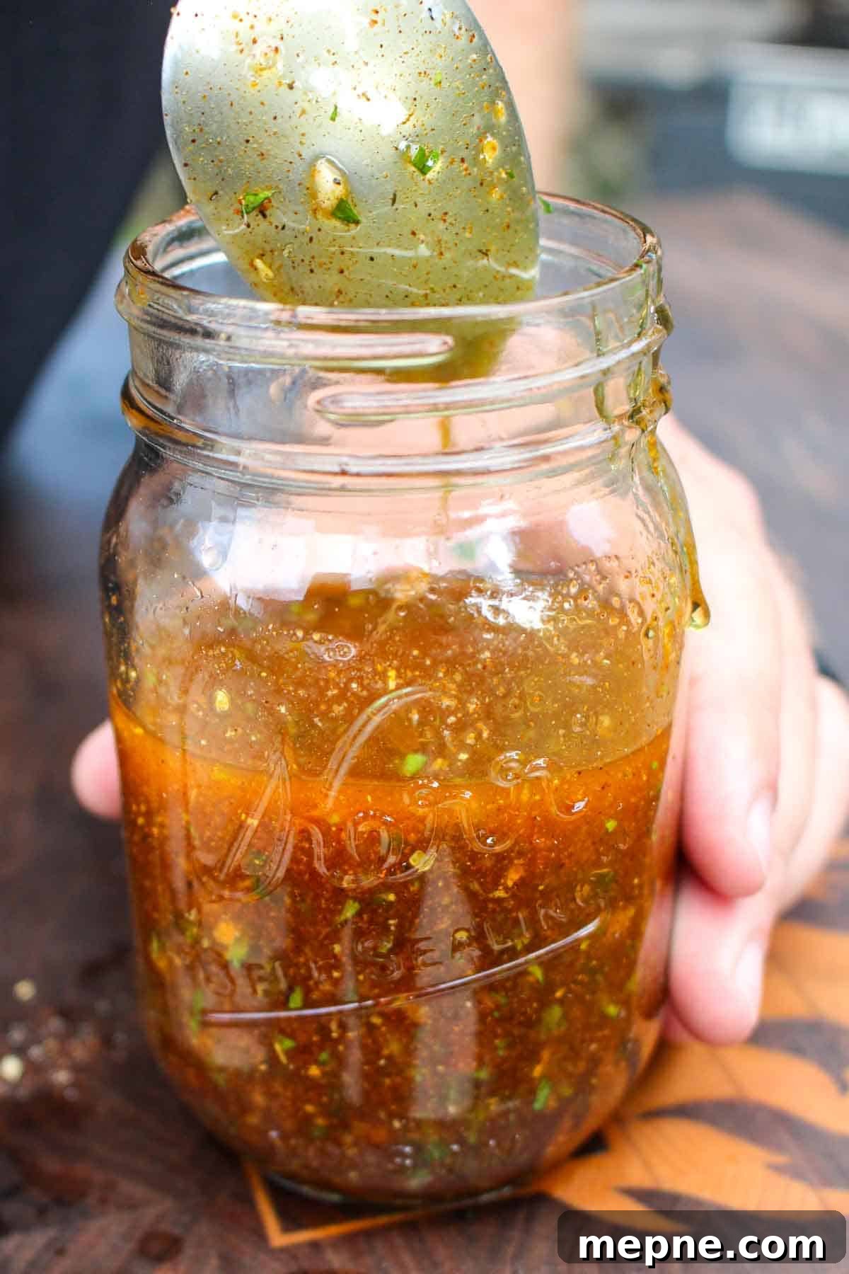 Hot Honey Butter Recipe for Biscuits and Chicken 7 Mixing the hot honey butter in the mason jar.