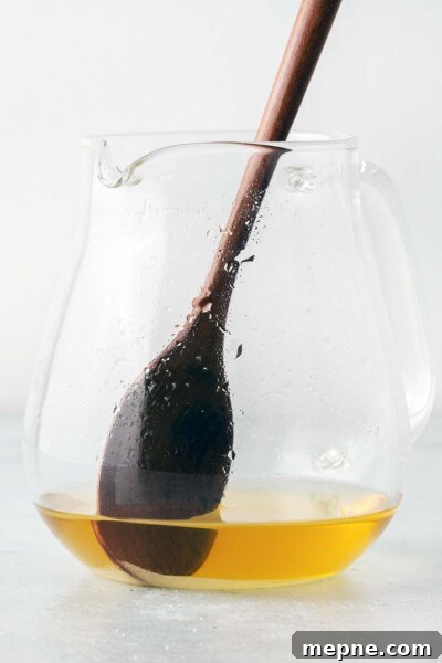 How to Make Iced Green Tea at Home 5 Stirring tea in a tea pot.