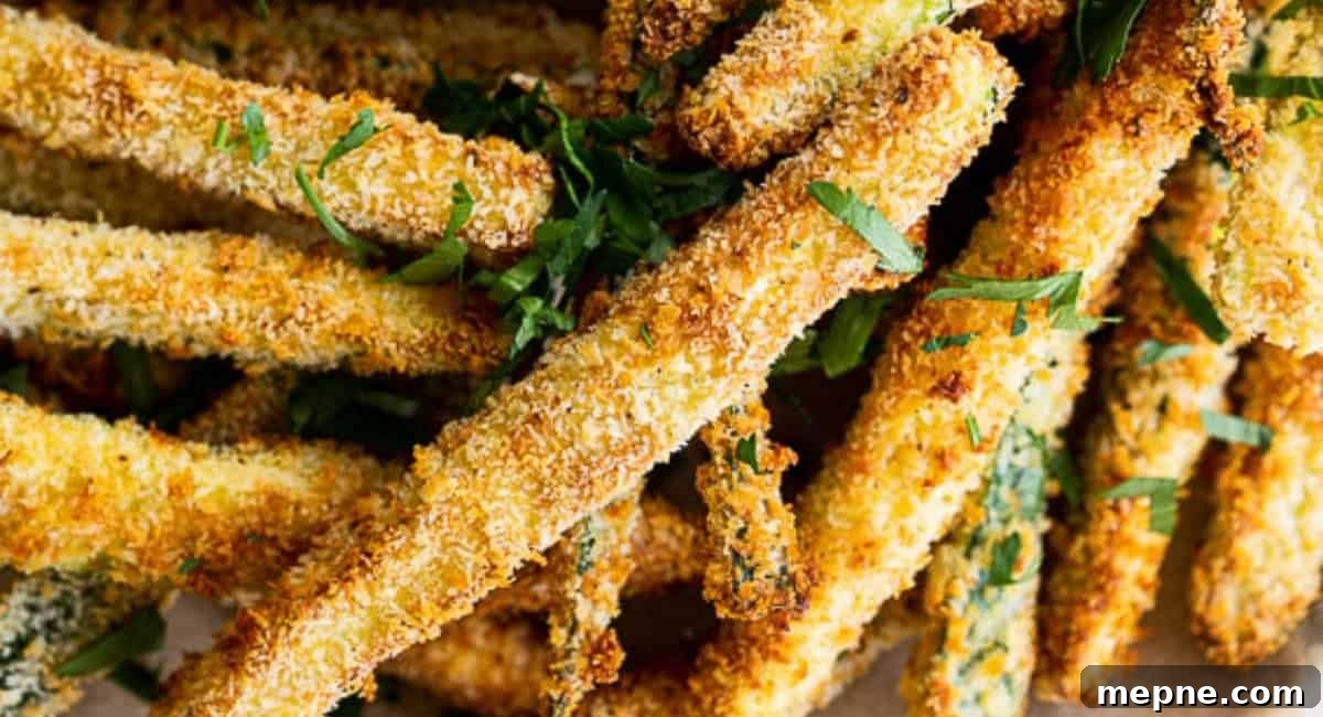 30 Side Dishes for French Dip Sandwiches 19 Overhead image of air fryer zucchini fries.