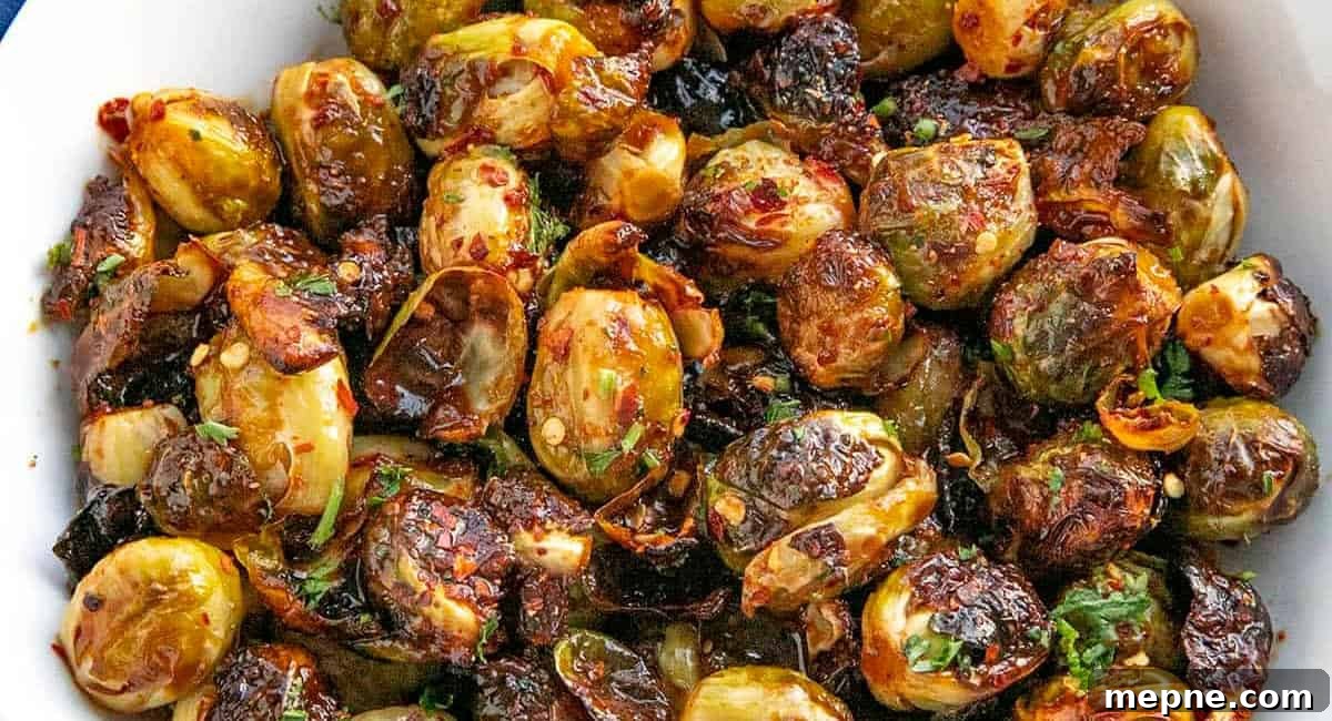 30 Side Dishes for French Dip Sandwiches 8 Overhead image of honey sriracha brussels sprouts.