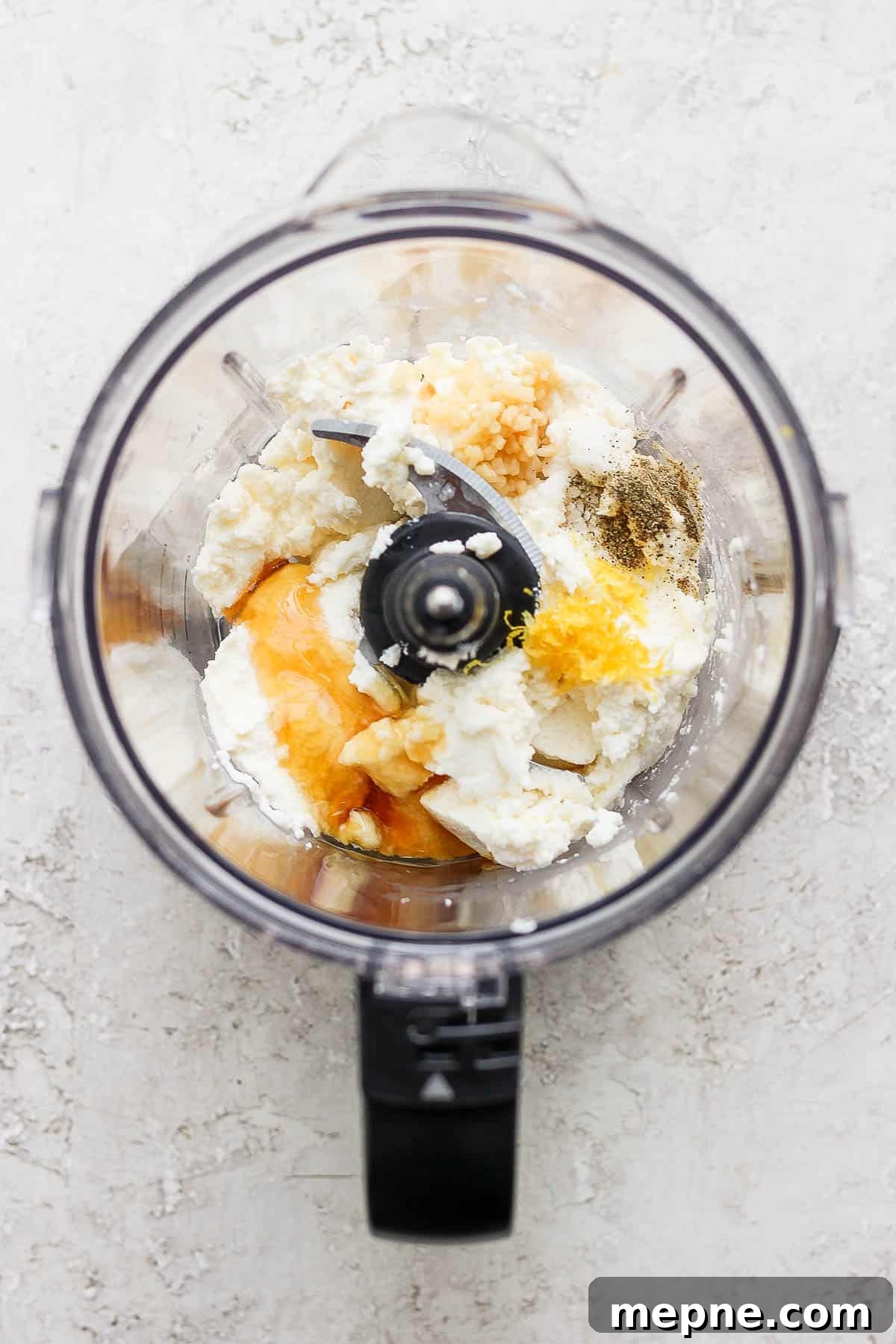 Honey Whipped Ricotta Spread for Toasts and Fruit 3 Ingredients for whipped ricotta in a food processor.
