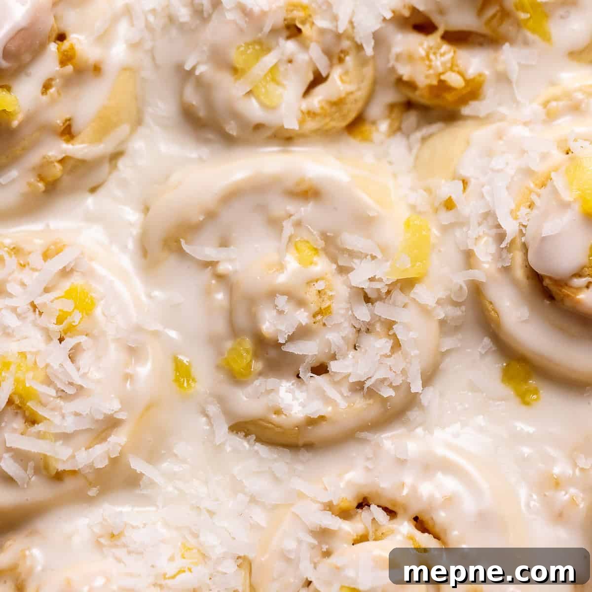 Pineapple coconut rolls in a baking pan.