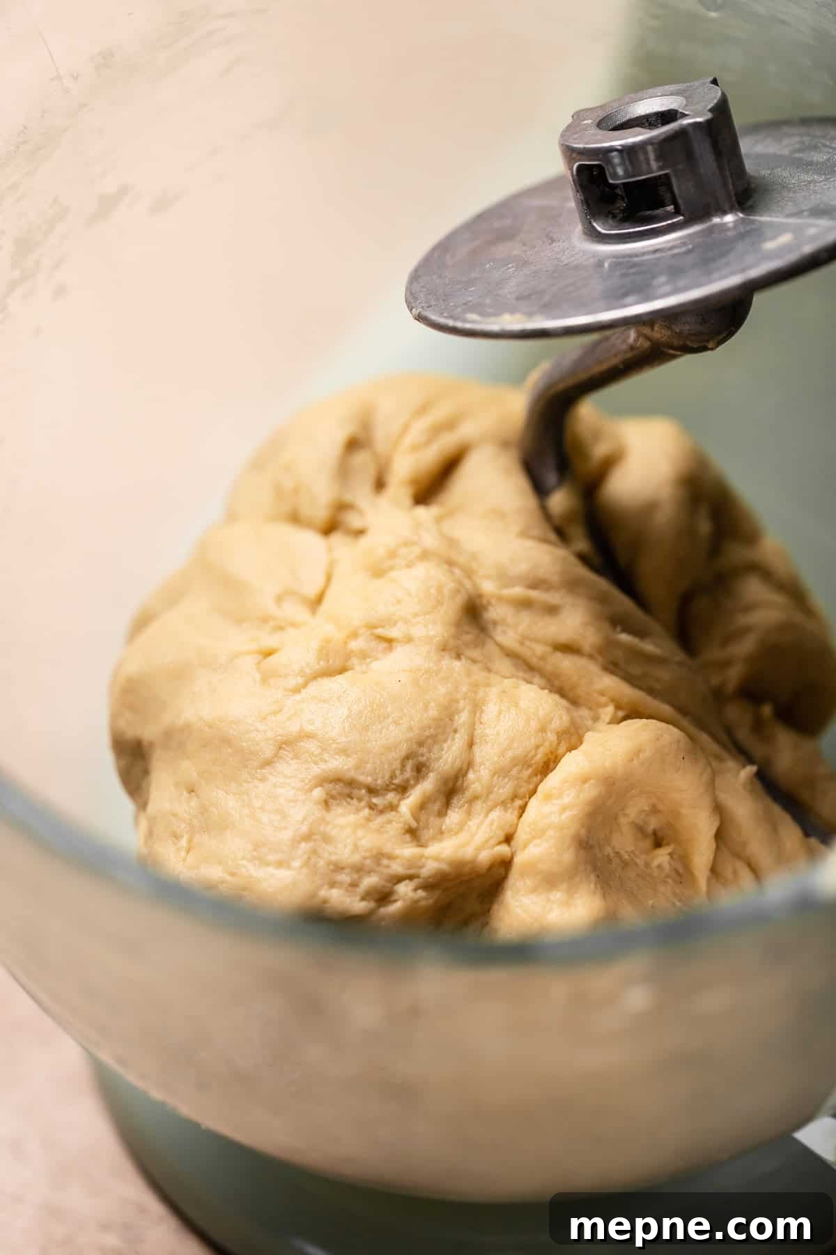 Tropical Pina Colada Cinnamon Rolls with Coconut Rum Icing 5 Soft, kneaded dough in a mixer bowl.