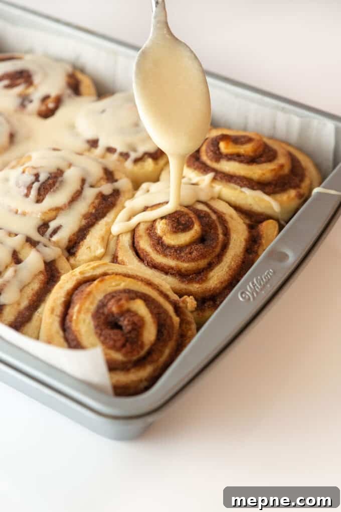 Homemade Cream Cheese Icing for Cinnamon Rolls 5 Cinnamon roll icing bowl and spoon