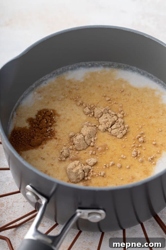 Small saucepan with milk, maca powder and cinnamon