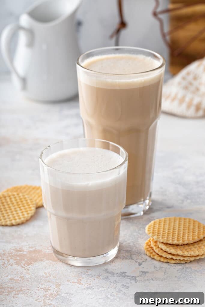 Glasses filled with maca latte, one with cocoa and turmeric