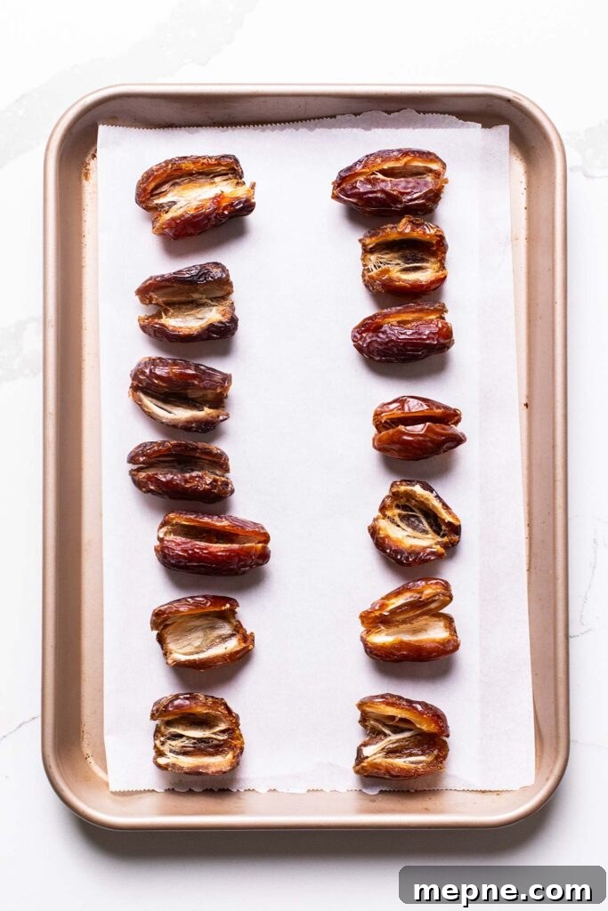 Chocolate-Stuffed Medjool Dates with Nut Butter 5 Dates shown pitted and sliced down the middle to open them to stuff.