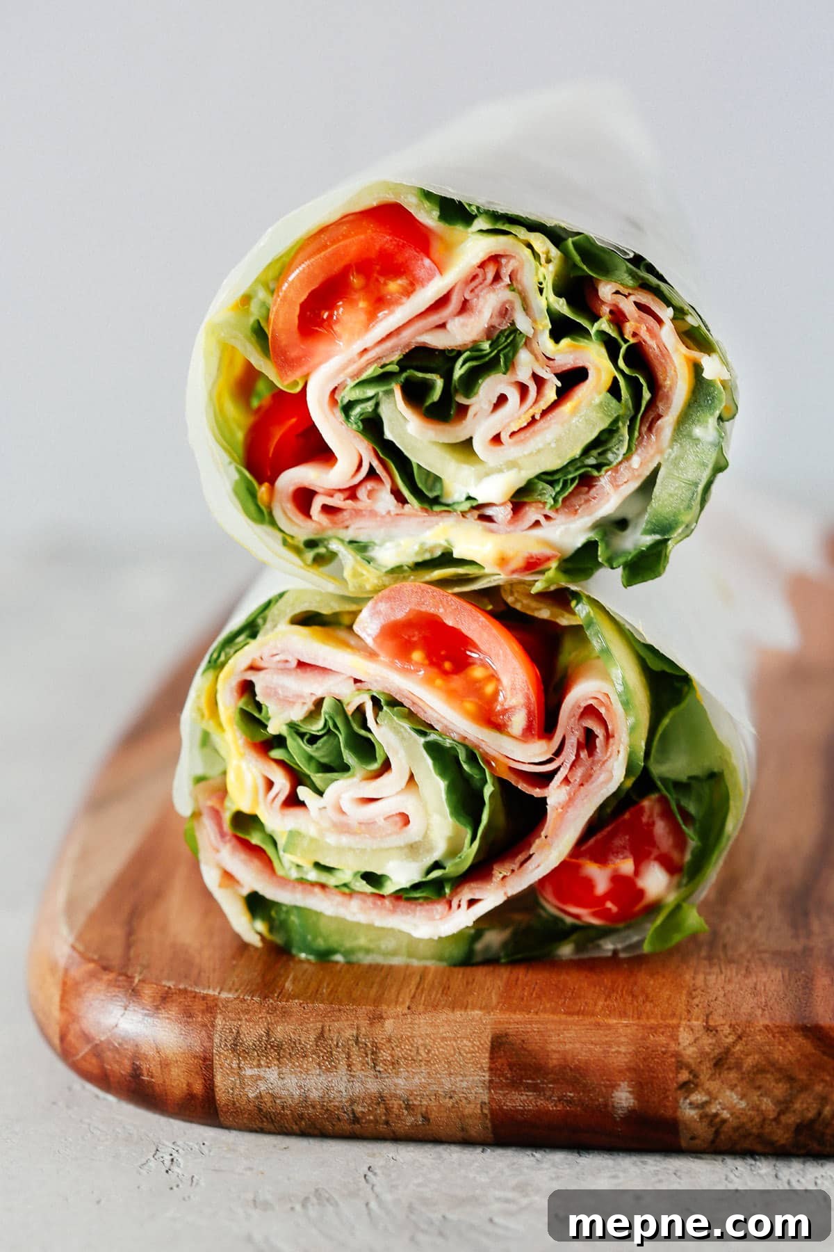Keto Dinner Recipes: Low-Carb Ideas for Weeknights 11 A lettuce wrap sandwich sitting on top of a wooden cutting board