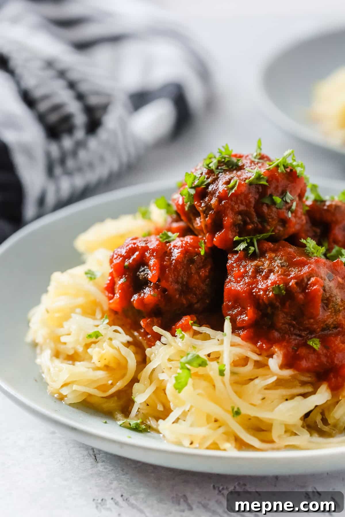Keto Dinner Recipes: Low-Carb Ideas for Weeknights 15 Close-up of spaghetti squash and meatballs.