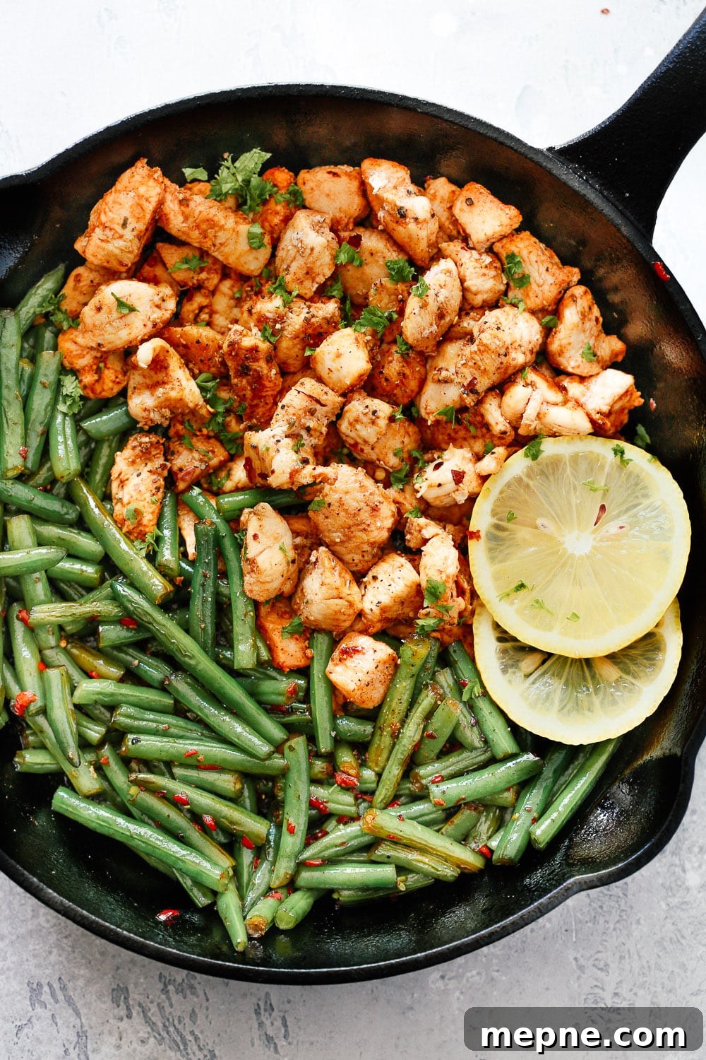 Keto Dinner Recipes: Low-Carb Ideas for Weeknights 19 overhead view of chicken with green beans in a cast iron skillet