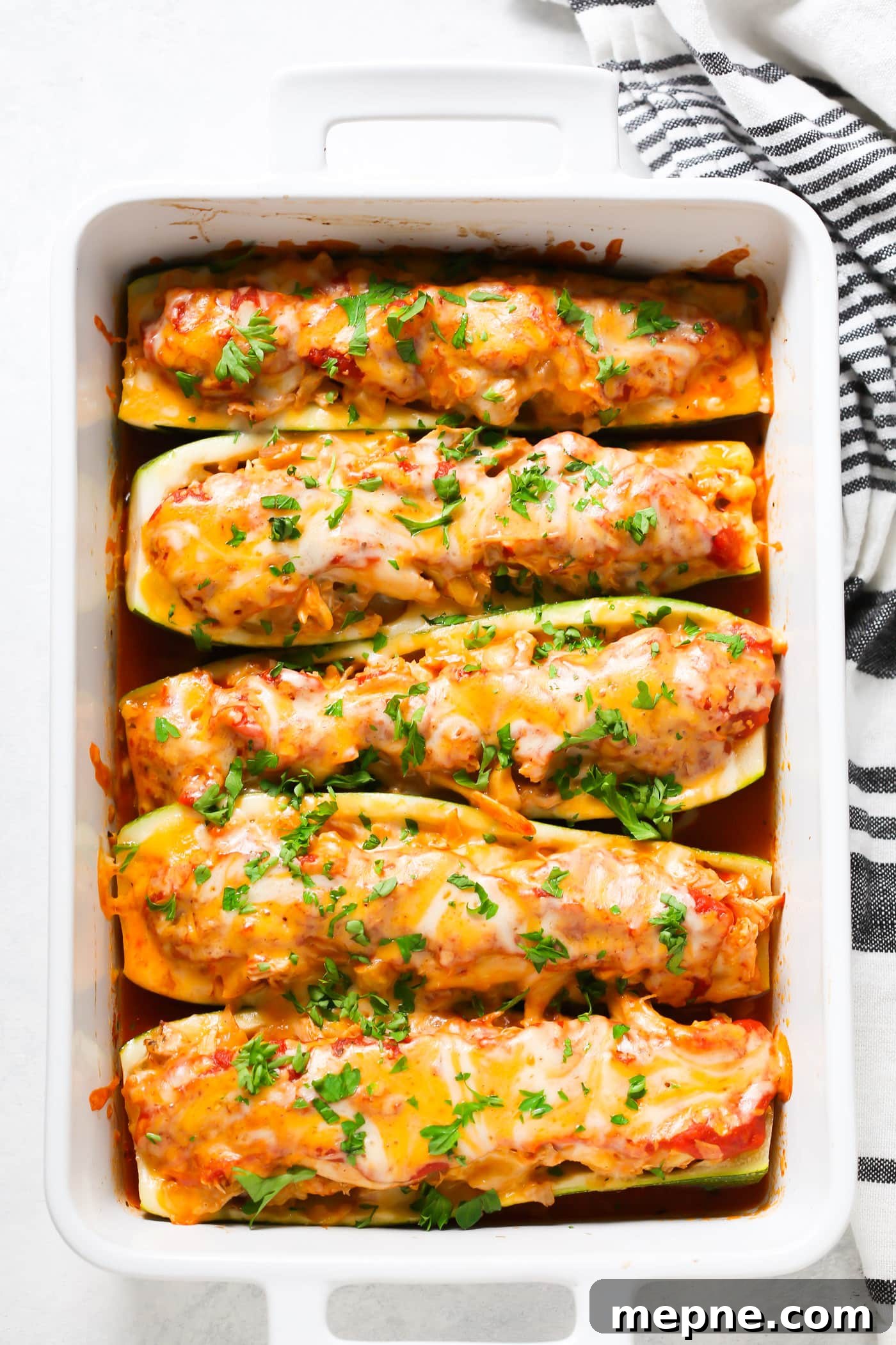 Keto Dinner Recipes: Low-Carb Ideas for Weeknights 3 zucchini chicken boats in a white casserole