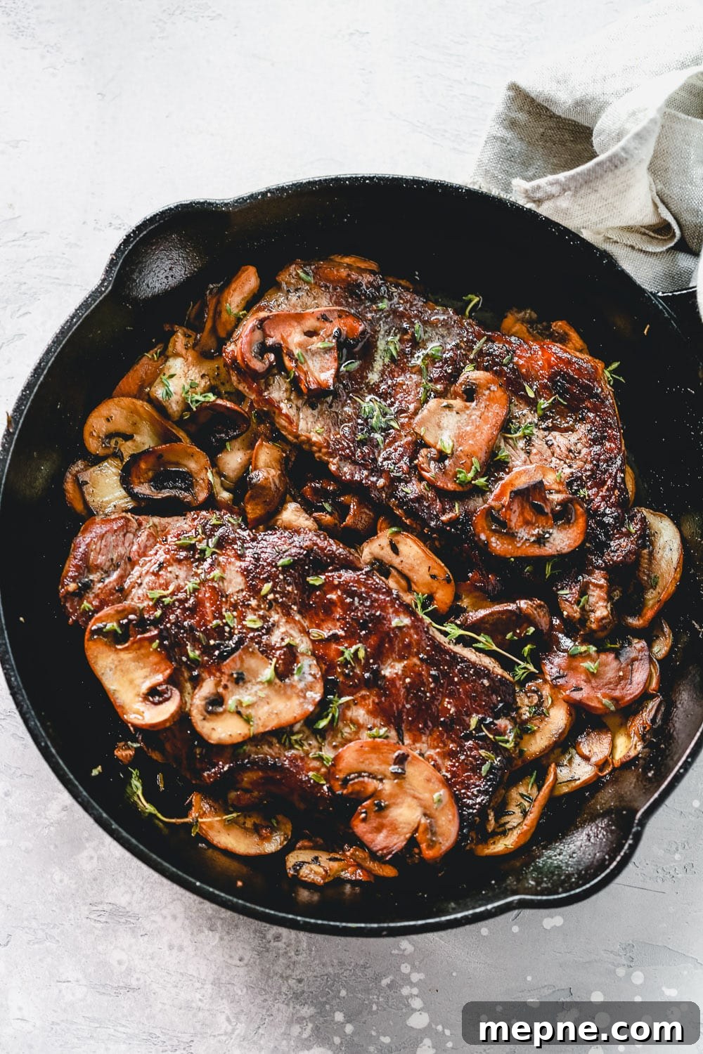 Keto Dinner Recipes: Low-Carb Ideas for Weeknights 21 overhead steak with mushroom in a cast iron skillet