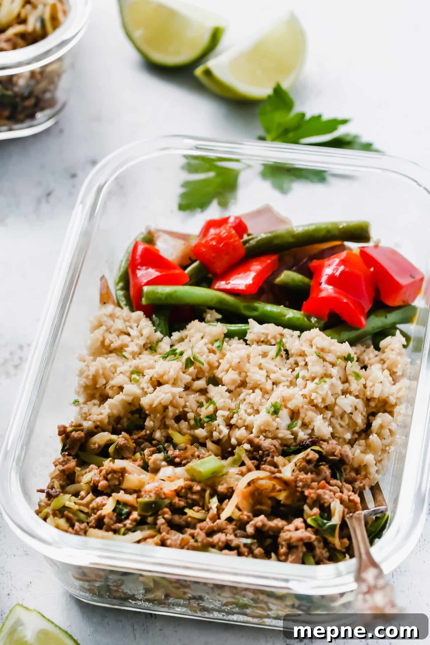 Keto Dinner Recipes: Low-Carb Ideas for Weeknights 30 ground beef, cauliflower rice and chopped veggies in a glass bowl
