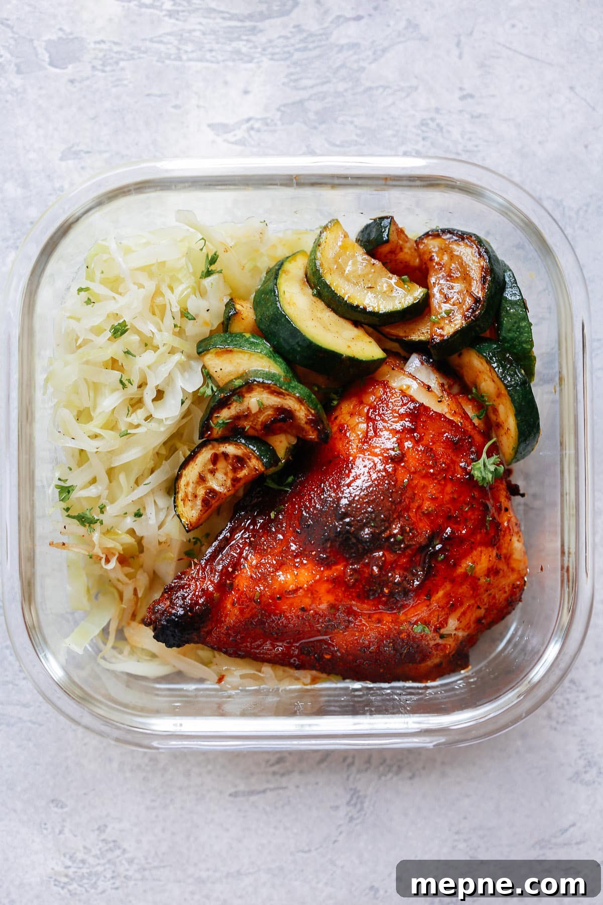 Keto Dinner Recipes: Low-Carb Ideas for Weeknights 9 Spicy Chicken with Sauteed Cabbage and Zucchini in glass meal prep container