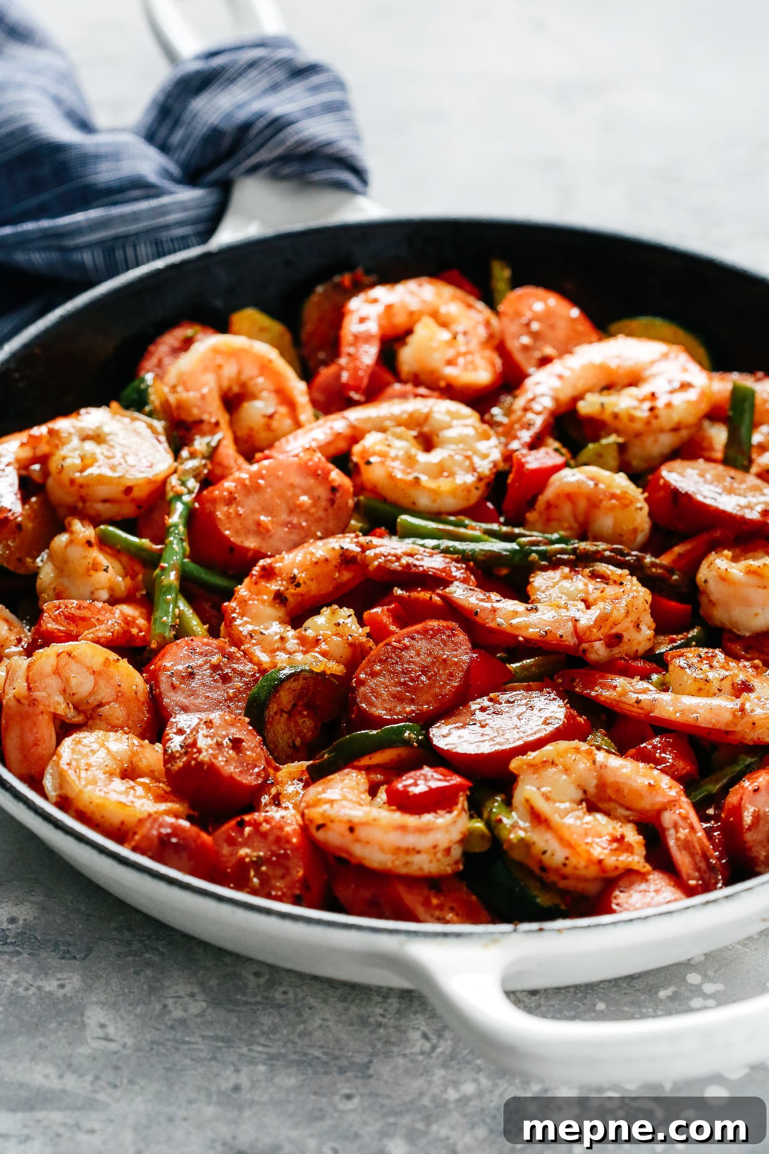 Keto Dinner Recipes: Low-Carb Ideas for Weeknights 10 close-up of shrimp and sausage in a white skillet.