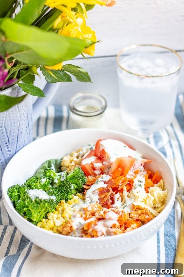Crispy Chicken Ranch Salad with Creamy Homemade Dressing 5 This Buffalo Chicken Quinoa Salad is made with spicy shredded buffalo chicken, shredded carrot, chopped celery, tomato, corn, broccoli, bacon, and cheese on a bed of quinoa and spinach. It's a quick, easy, and healthy weeknight meal.