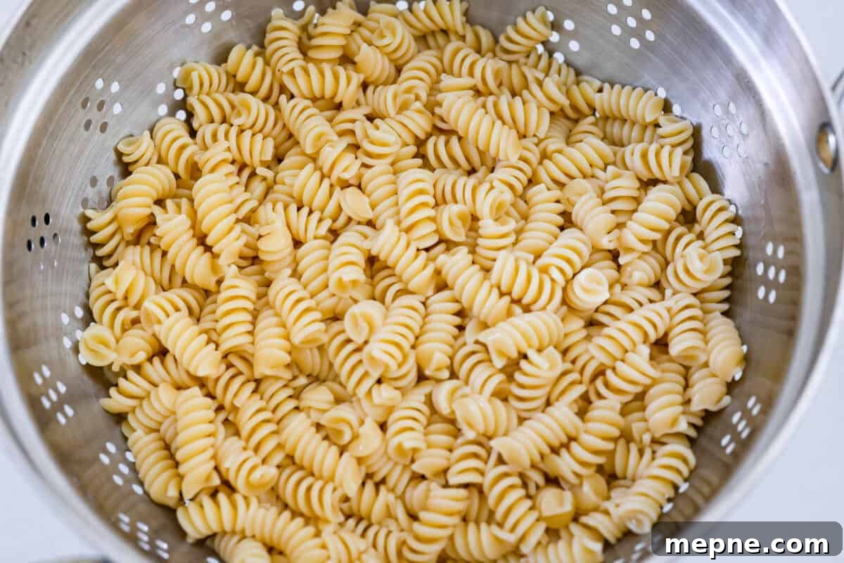 Cooked pasta in a colander.