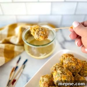 Turkey Sausage Balls Recipe 11 dipping a turkey ball made with turkey sausage into a mustard dipping sauce.