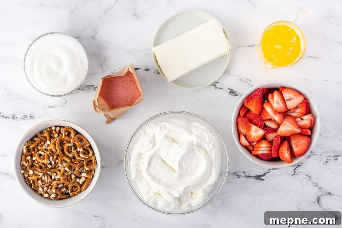 Ingredients for strawberry pretzel dessert on a counter.