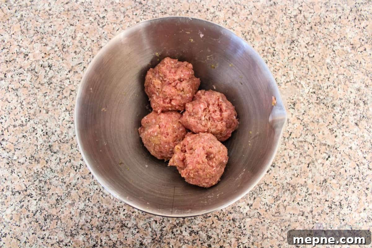 Oven Baked Pork Meatballs with Italian Seasoning 5 Meatball mixture after it has been divided into quarters.