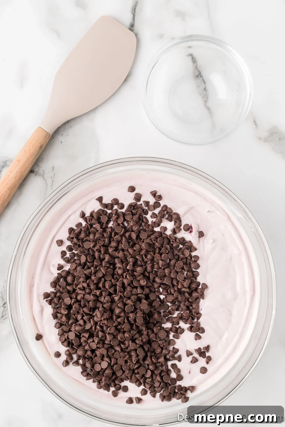 Homemade Cherry Chocolate Chip Ice Cream Recipe 6 Chocolate chips folded into ice cream base.