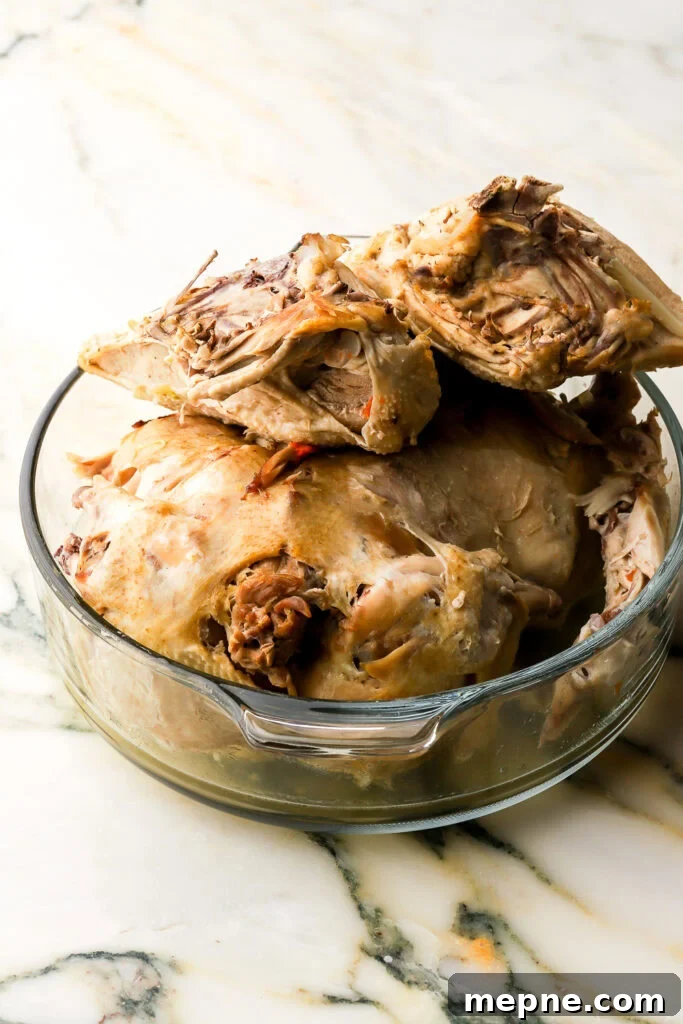Romanian Chicken Soup (Ciorbă de pui) Recipe 11 cooked chicken on the bone, in a bowl