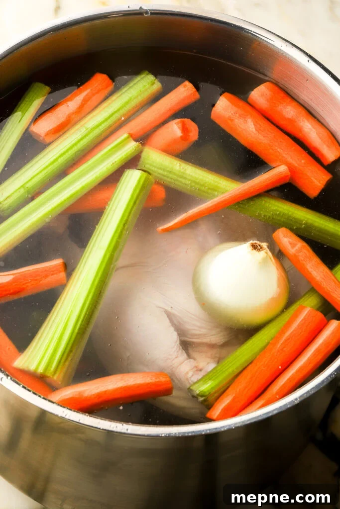 Romanian Chicken Soup (Ciorbă de pui) Recipe 6 pot filled with vegetables, chicken and water to the top