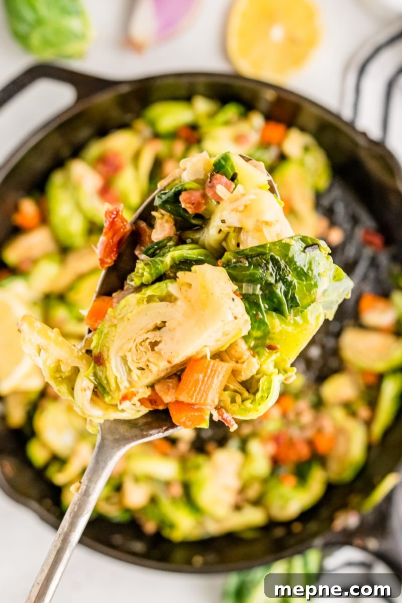 Lemon Brussels Sprouts spoonful of brussels sprouts over a skillet