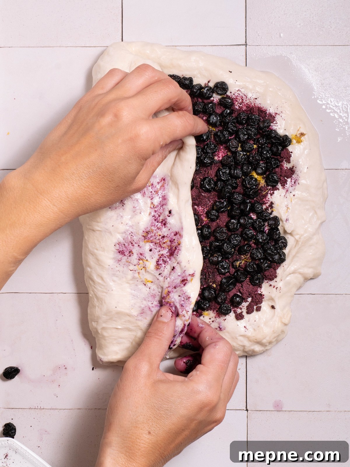 Homemade Blueberry Sourdough Bread Recipe 5 Folding blueberry powder and dried blueberries into sourdough
