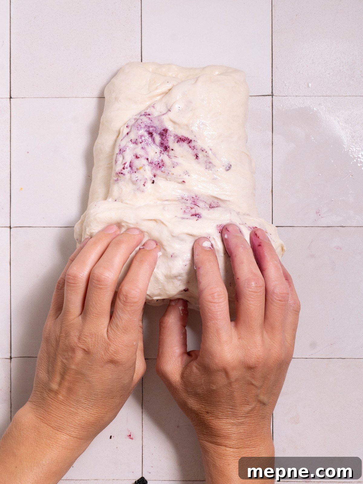 Homemade Blueberry Sourdough Bread Recipe 7 Rolling laminated sourdough into a rough ball