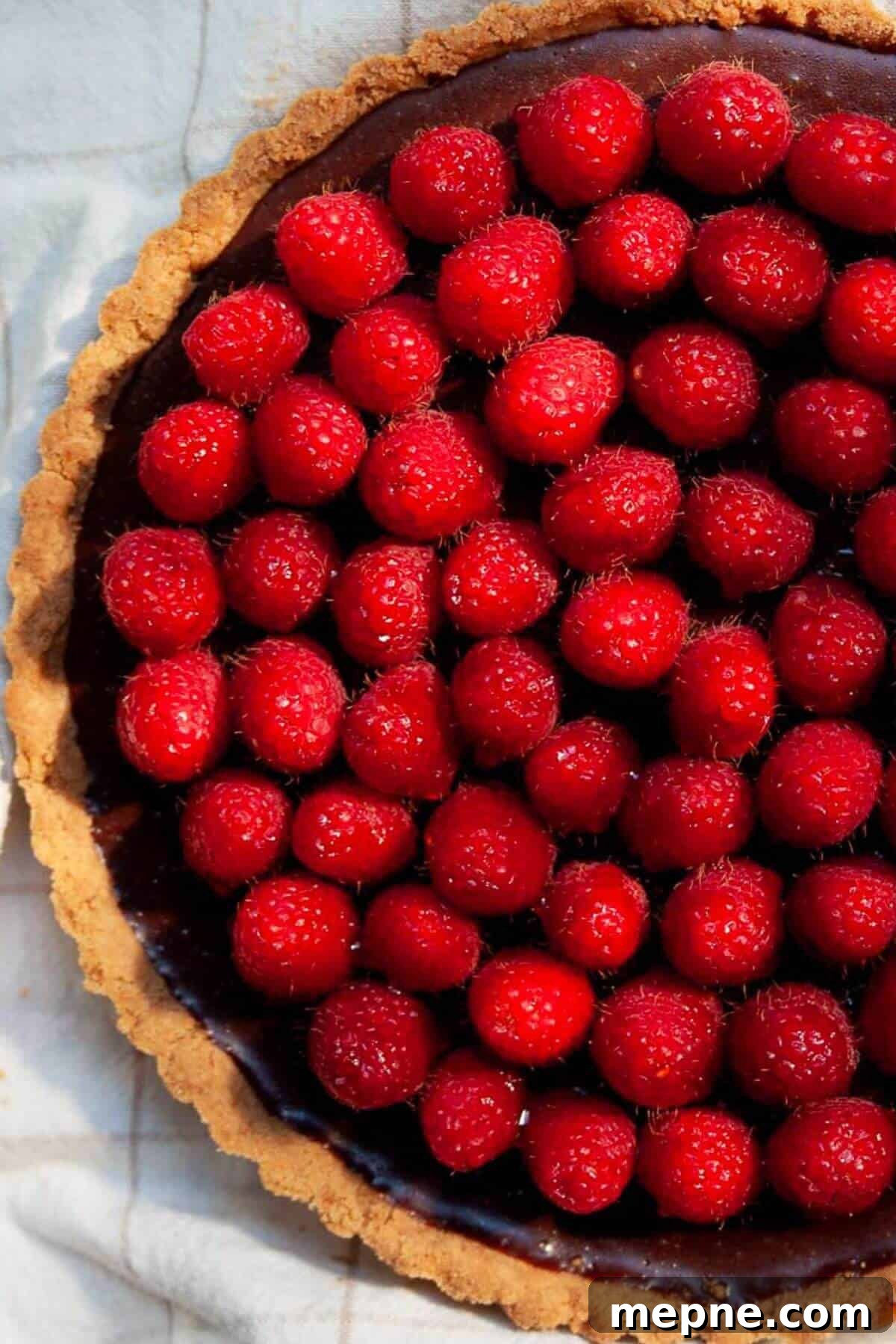 Dark Chocolate Raspberry Tart Recipe 10 Easy dark chocolate raspberry tart with fresh raspberries glazed in honey.
