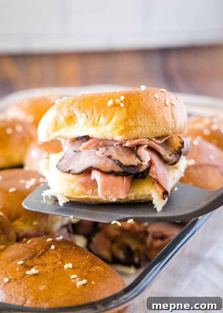 French Dip Sliders Recipe: Mini Beef Sandwiches with Au Jus 4 french dip slider on a spatula