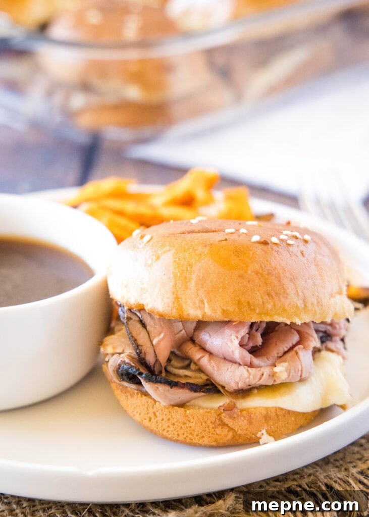 French Dip Sliders Recipe: Mini Beef Sandwiches with Au Jus 5 white plate with french dip slider with au jus