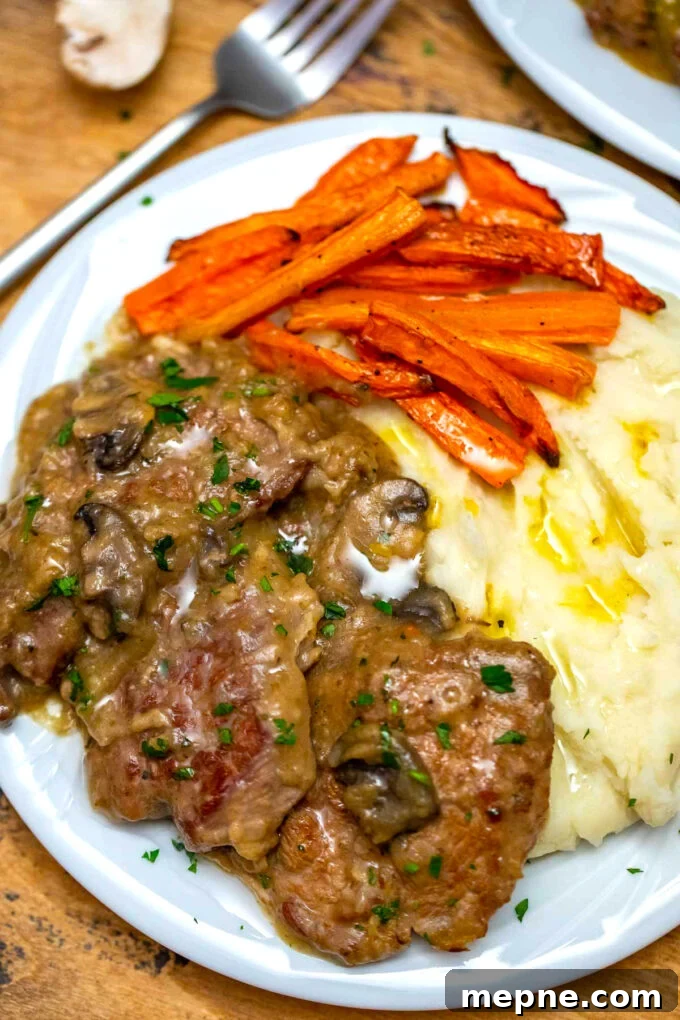 Tender Slow Cooker Swiss Steak Recipe 8 Crockpot Swiss steak with gravy and mashed potatoes.