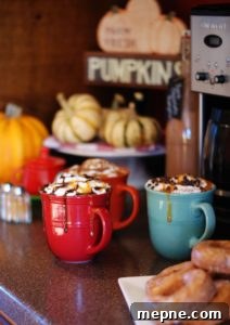 Holiday coffee bar styling with mugs and fall flavors