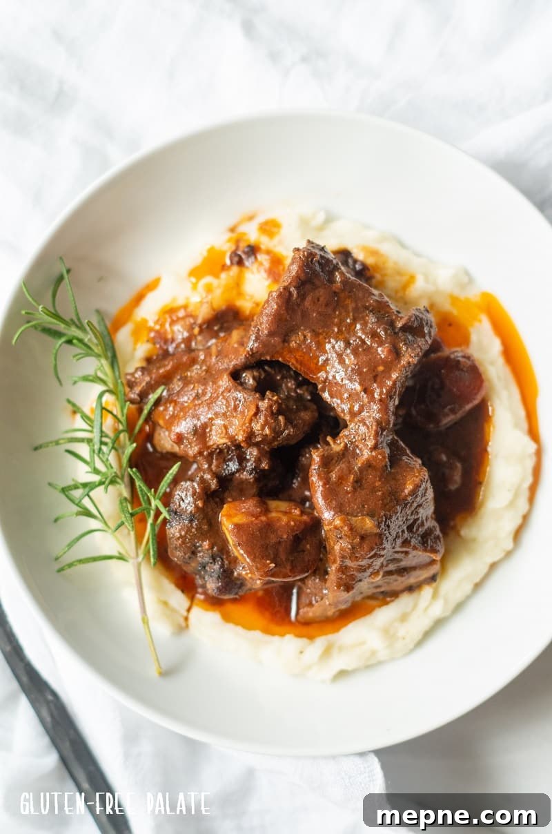 Tender Slow Cooker Beef Short Ribs Recipe 6 top down view of beef short ribs over mashed potatoes