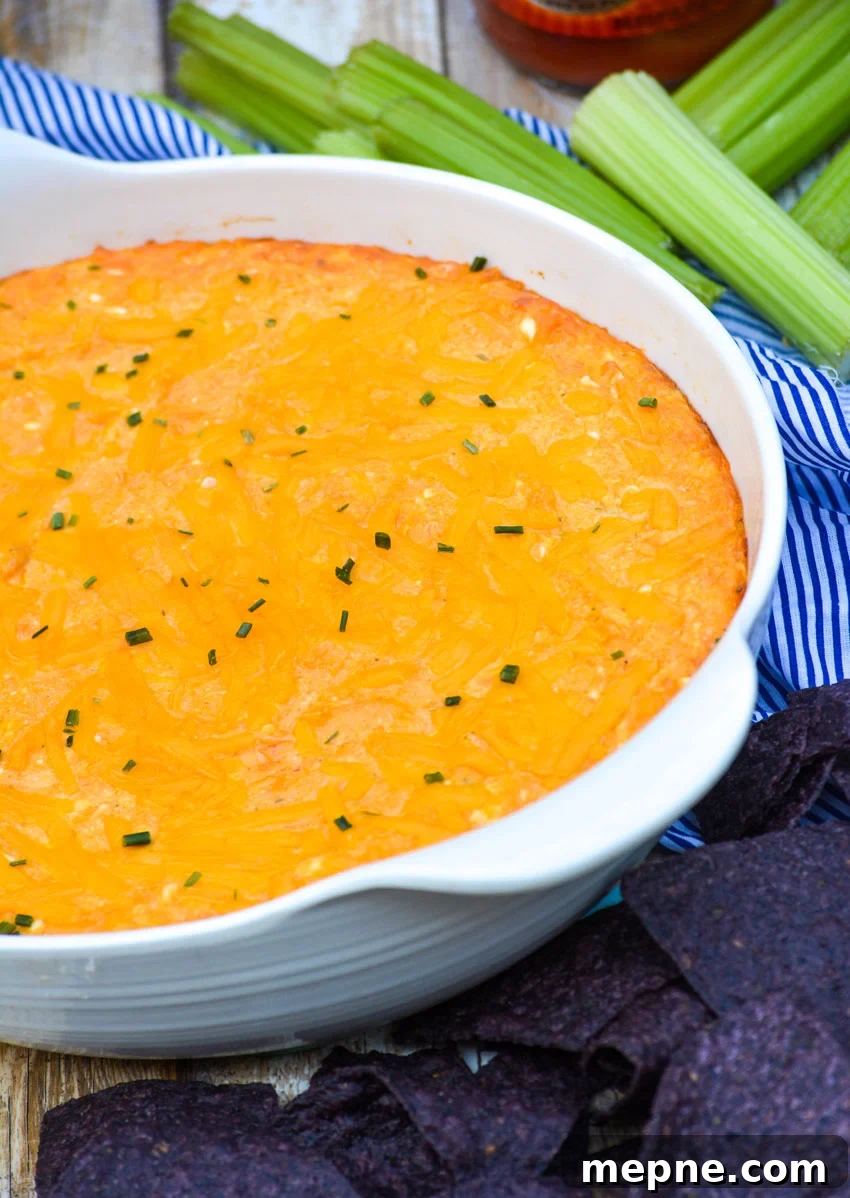 the best buffalo chicken dip in a white serving bowl