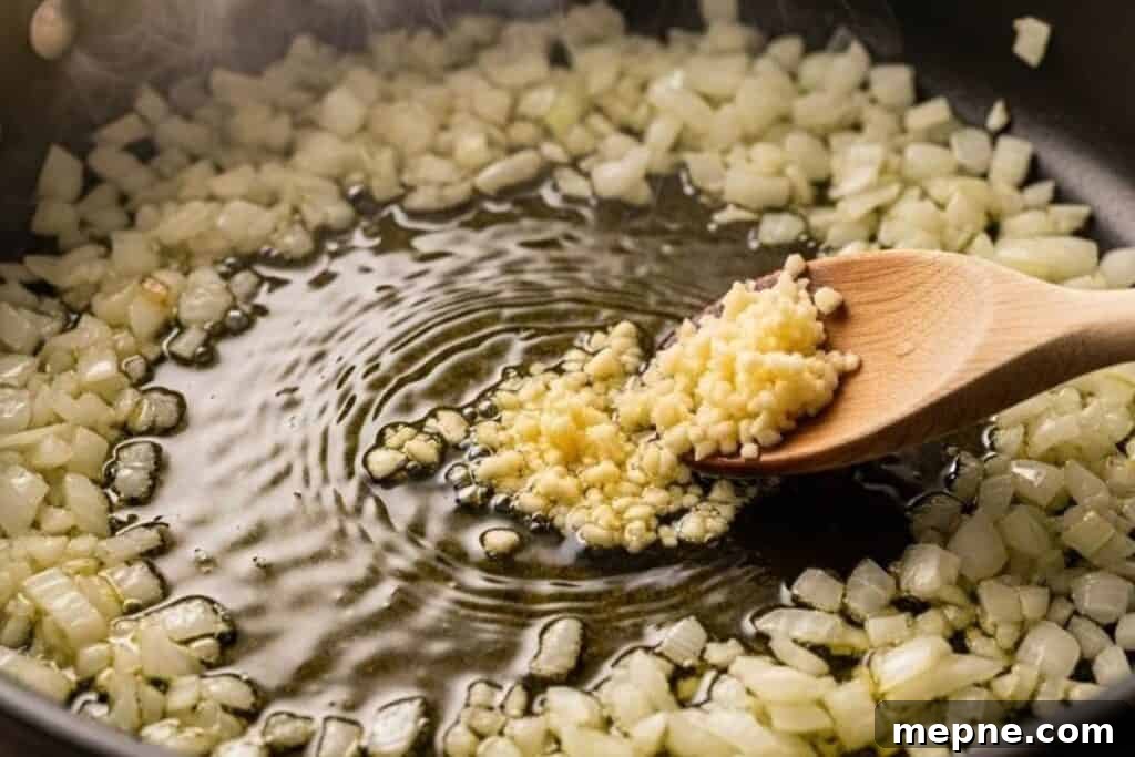 Hearty Lentil Soup Recipe with Vegetables 4 Sautéing onion for lentil soup