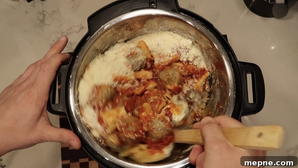 Instant Pot Meatballs with Marinara Pasta 13 Mixing everything together in the pot