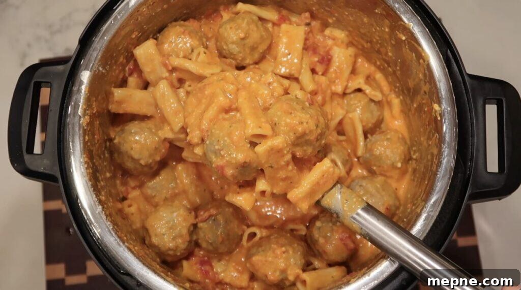 Instant Pot Meatballs with Marinara Pasta 14 Mixed pasta tossed in sauce in pot