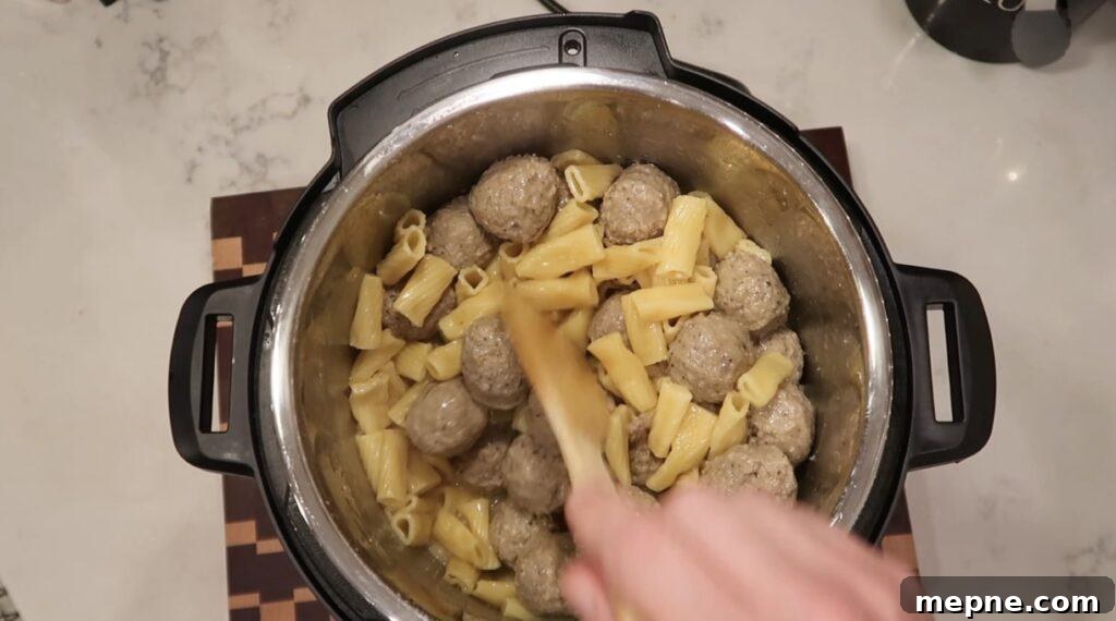 Instant Pot Meatballs with Marinara Pasta 9 Stirring pasta and meatballs