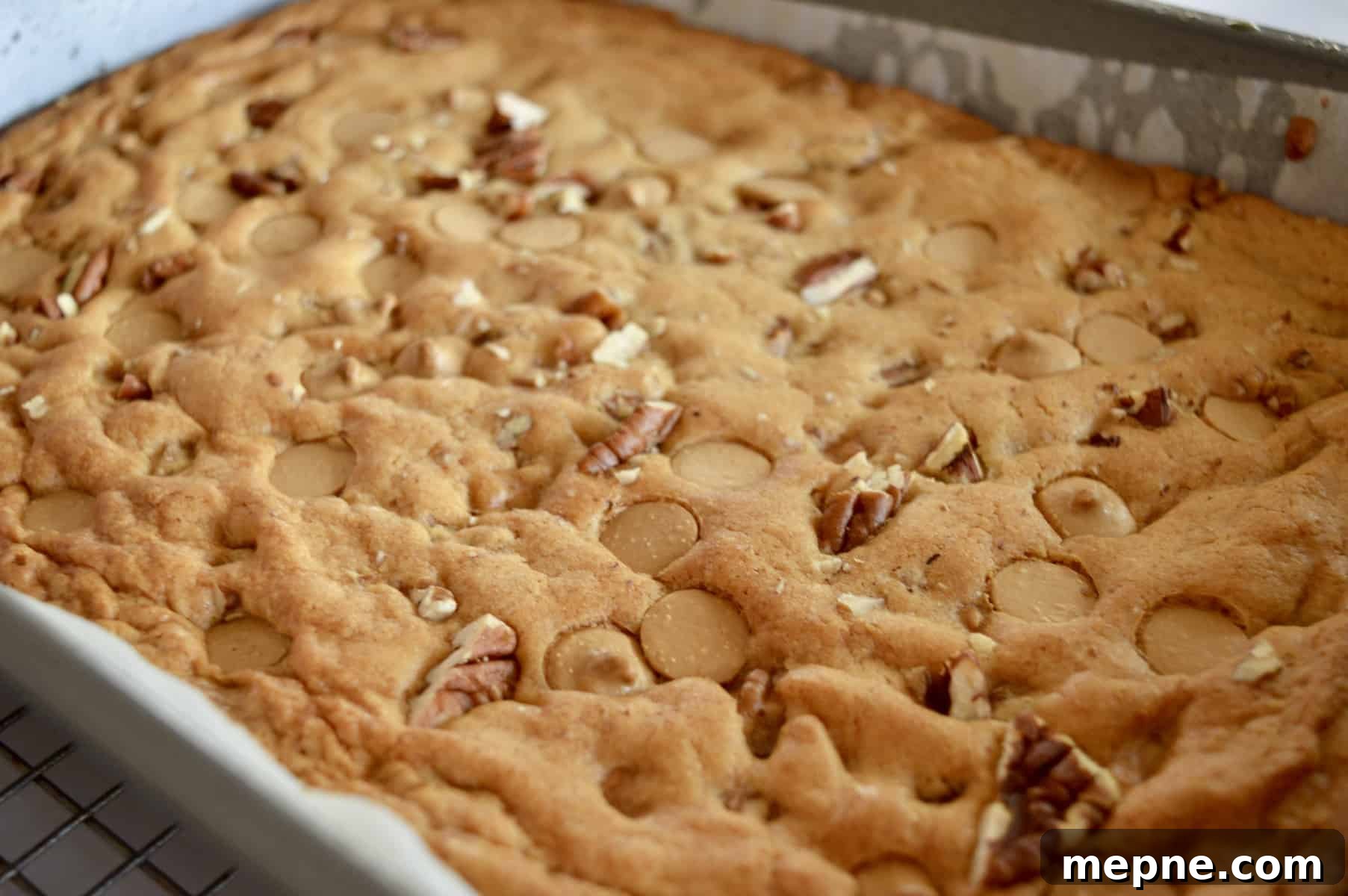 Gooey Caramel Chip Pecan Bars Recipe 5 baked bars in pan
