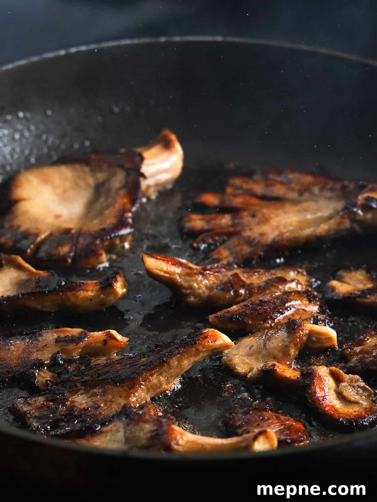 Crispy Chinese Fried Oyster Mushrooms with Vegan Char Siu Recipe 8 Photo showing vegan Char Siu mushrooms frying in a pan.